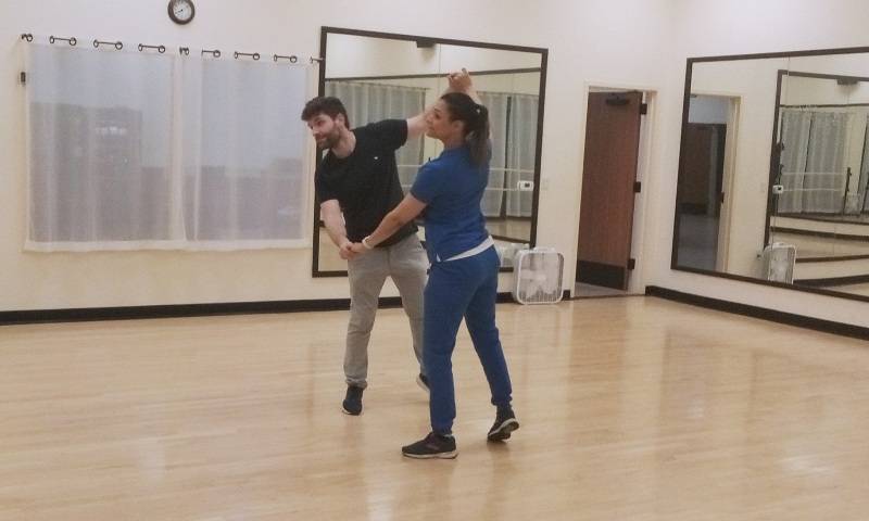 Students learning to dance in private dance lesson